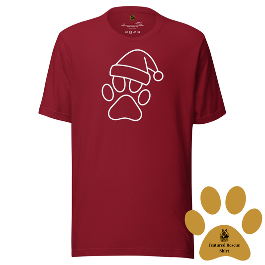 Crimson unisex t-shirt with a white paw print wearing a Santa hat design. A gold paw in the corner of the image symbolizes this is the current Boozie Adams Featured Rescue Shirt – Boozie Adams