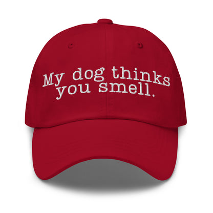 Red cap with white text 'My dog thinks you smell' – Boozie Adams