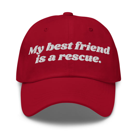 A red unisex dad hat with embroidered text 'My best friend is a rescue.' – Boozie Adams
