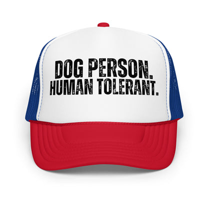 A blue, red and white trucker hat with the text 'DOG PERSON. HUMAN TOLERANT.' – Boozie Adams