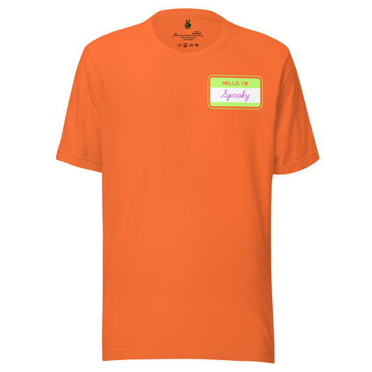 Orange unisex t-shirt with a green name tag with 'Hello I'm Spooky' text in purple – Boozie Adams