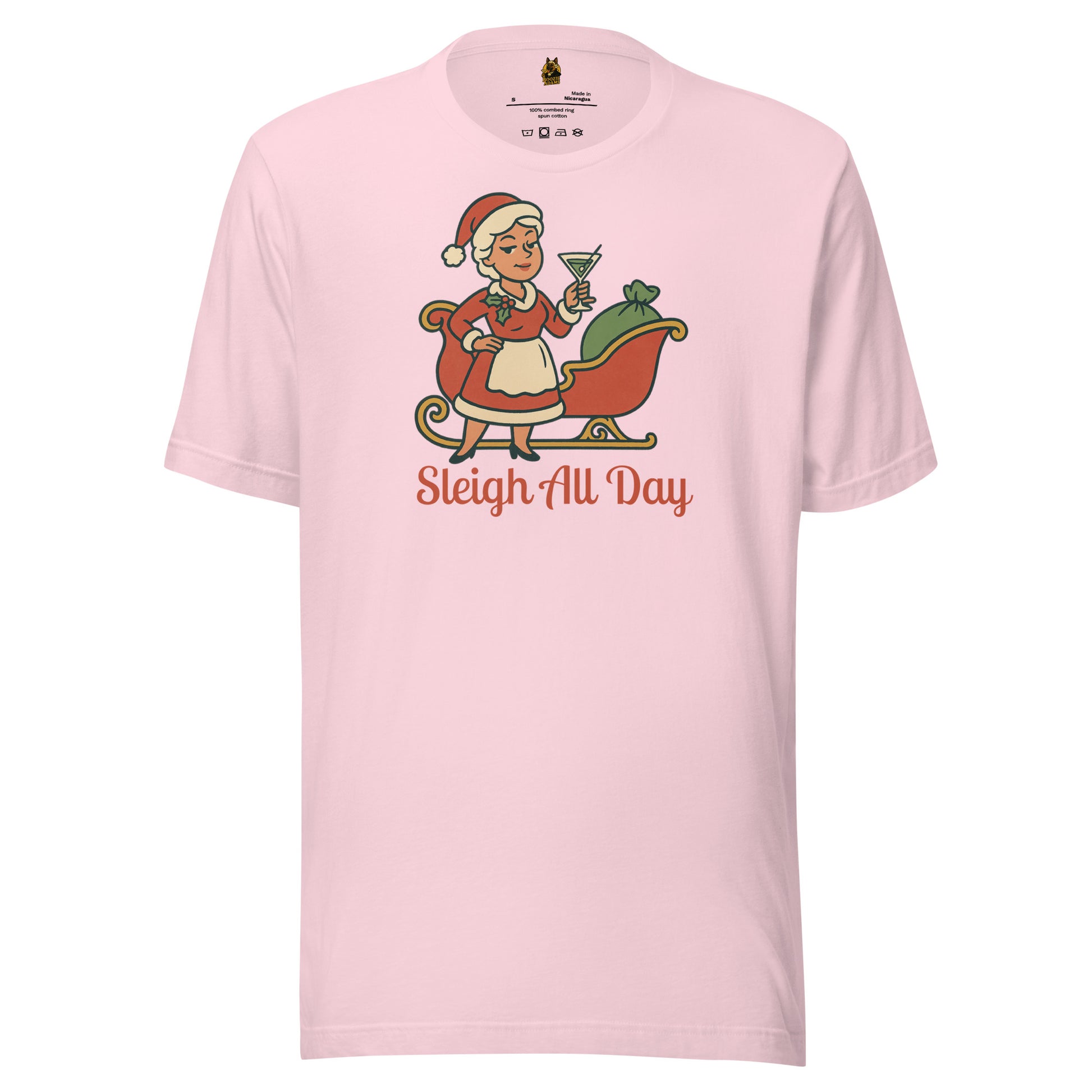 Pink unisex t-shirt with a graphic of a Mrs Claus in front of a sleigh, holding a martini glass, with text 'Sleigh All Day' in red – Boozie Adams